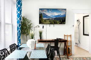 Dining space featuring carpet flooring and baseboards