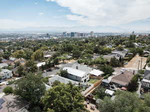 View of urban area with a mountainous background and nearby suburban area