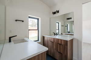 Full bathroom with two vanities