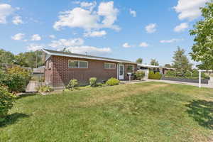 Ranch/Rambler-style house with brick siding and driveway