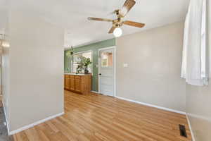 Dining room featuring light wood-style vinyl flooring and ceiling fan