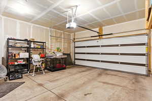 Garage featuring a garage door opener