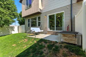 Back of property with a patio