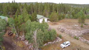 View of property location featuring a heavily wooded area