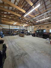 Garage with a workshop area and metal wall