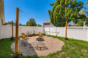 Firepit with outdoor lighting for relaxing & entertaining.