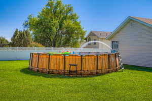 Huge backyard with above the ground pool