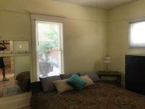 1st Bedroom on main featuring wood finished floors. Big closet!
