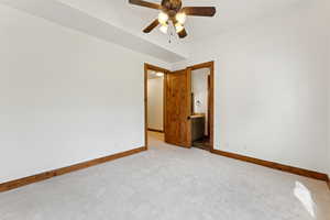 Unfurnished room featuring carpet floors and ceiling fan