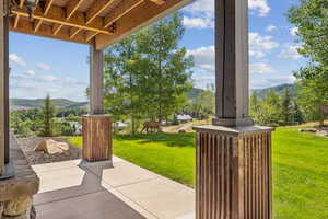 View of patio with a mountain view and a view of rural / pastoral area