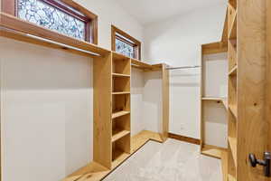 Walk in closet featuring carpet floors