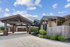 View of side of home with stucco siding and driveway
