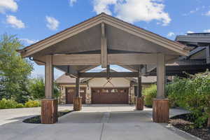 View of community with driveway and a garage