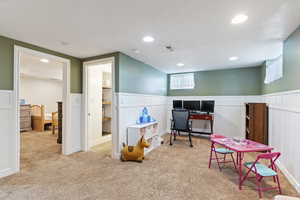 Playroom with recessed lighting, an office area, carpet flooring, and wainscoting