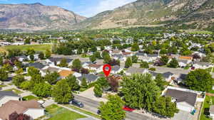 Aerial perspective of suburban area with a mountainous background