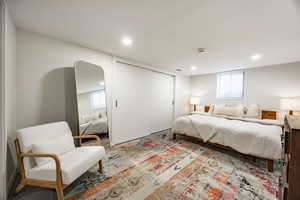 Bedroom featuring recessed lighting and a closet