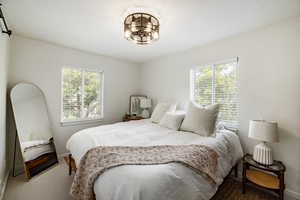 Carpeted bedroom with baseboards
