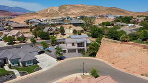 Aerial view of residential area featuring mountains