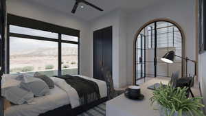 Bedroom featuring a mountain view and ceiling fan