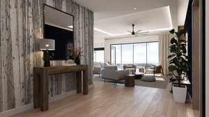 Living room featuring wood finished floors and ceiling fan