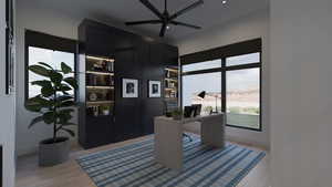 Office area with light wood-style floors, a ceiling fan, and recessed lighting