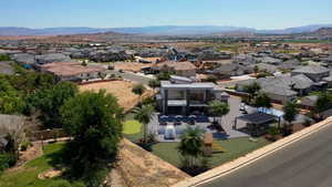 Aerial view of residential area featuring a mountainous background