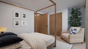 Bedroom with light wood-style floors and recessed lighting
