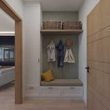 Mudroom featuring light wood finished floors