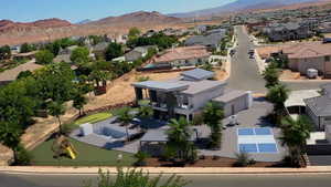 Aerial perspective of suburban area featuring a mountainous background