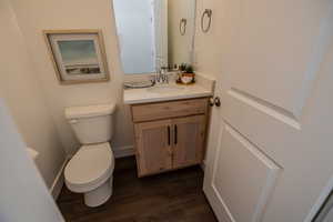 Bathroom with vanity and wood finished floors