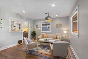 Living room with wood finished floors and recessed lighting