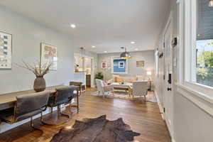 Dining area featuring wood finished floors and recessed lighting