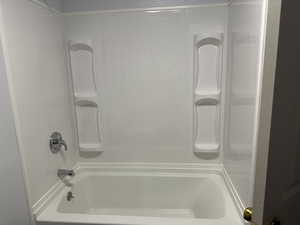 Full bath featuring bathing tub / shower combination