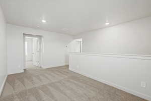 Spare room with carpet floors and recessed lighting
