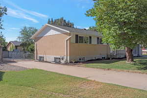 View of side of home featuring brick siding