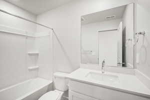 Bathroom featuring vanity and bathtub / shower combination
