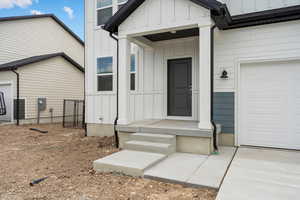Entrance to property with board and batten siding