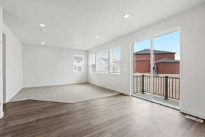 Spare room with recessed lighting and wood finished floors