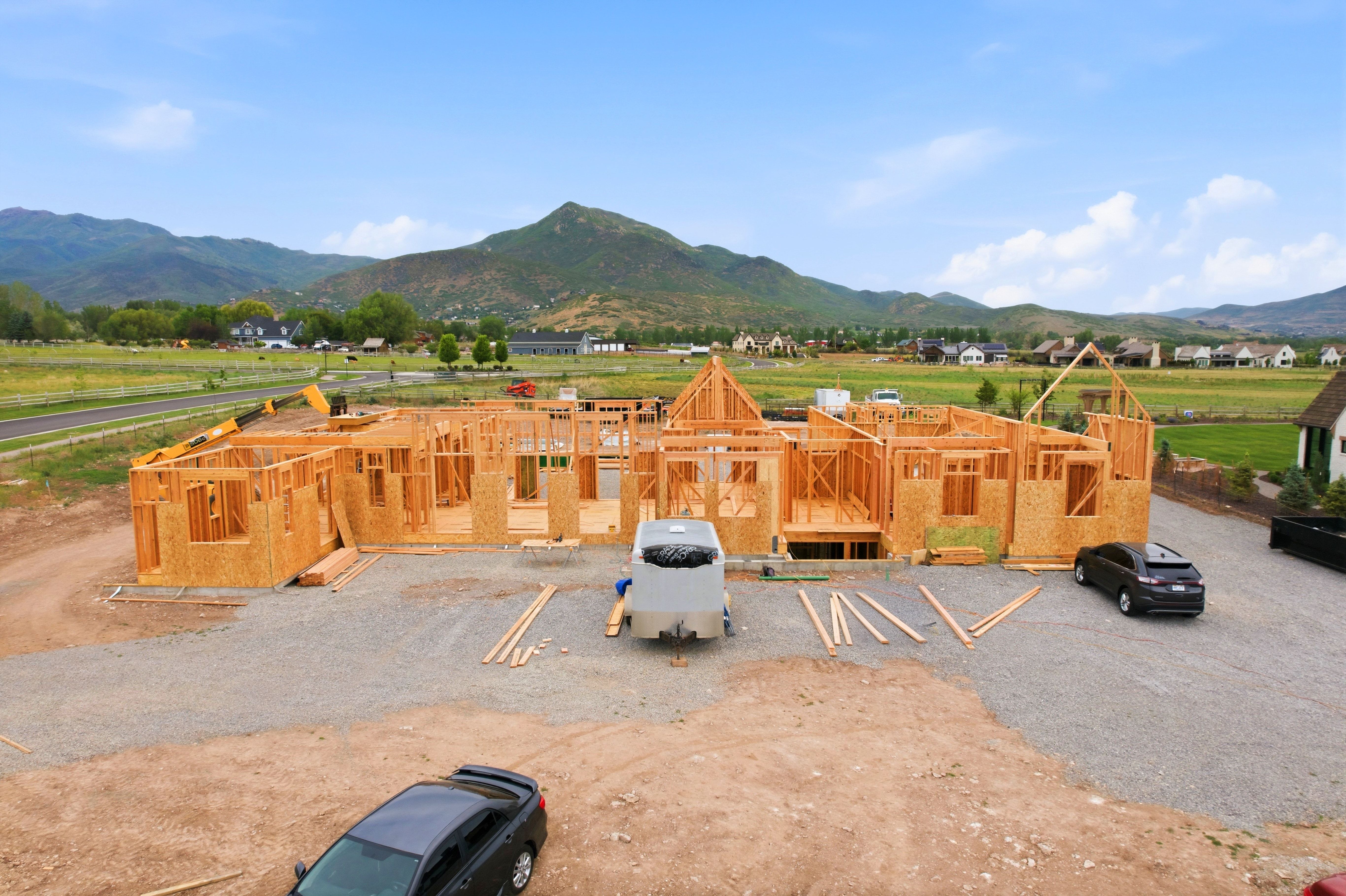 New construction framing with a partial foundation and rough openings for windows and doors