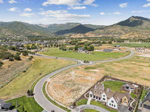 Aerial view of residential area featuring a mountain backdrop