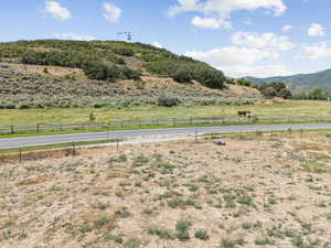 View of mountain backdrop with rural landscape