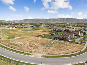 Aerial view of residential area featuring a water and mountain view