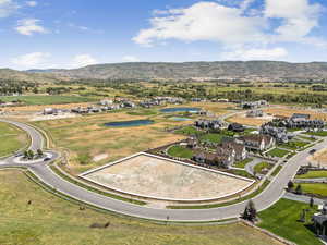 Aerial perspective of suburban area featuring a water and mountain view