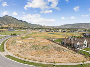 View of mountain background with a large body of water and nearby suburban area