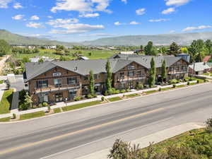 Aerial view of residential area featuring a mountainous background
