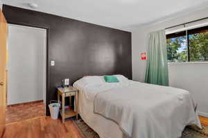 Bedroom with wood finished floors