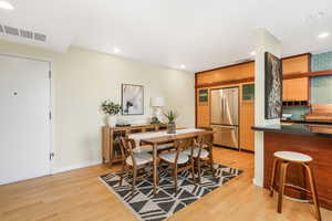 Dining room featuring recessed lighting and light wood finished floors