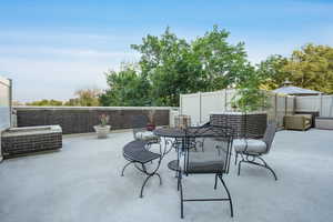 Fenced backyard featuring a patio and outdoor dining area