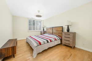 Bedroom with baseboards and light wood-type flooring