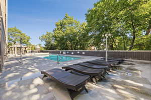 Community pool with a patio area